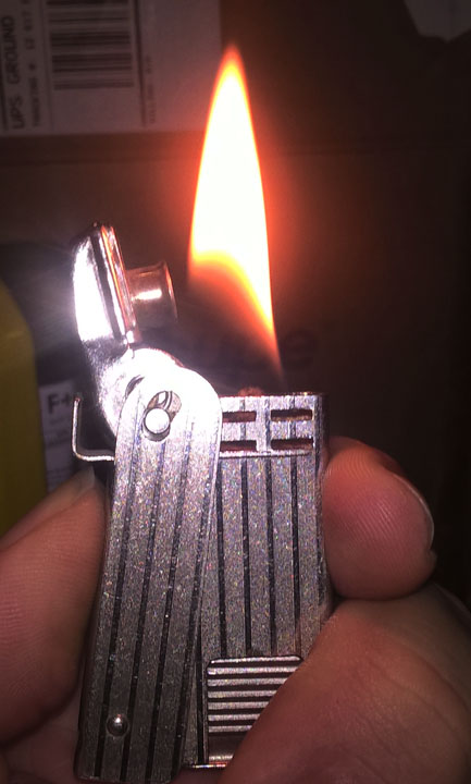 Regens Squeeze Lighter Lit s.jpg