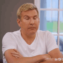 todd-chrisley-arms-crossed.gif