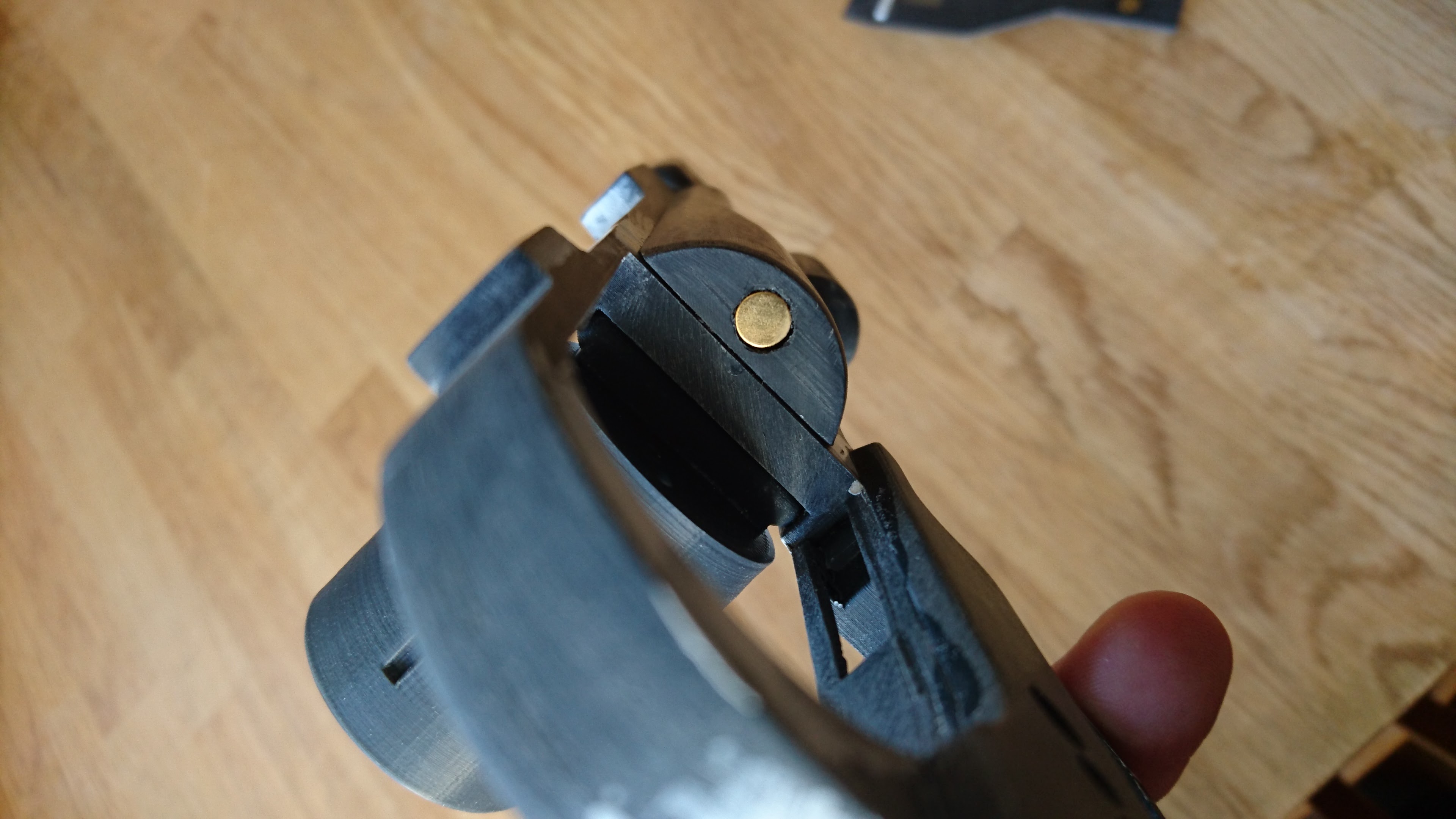 Added a magnet to hold the cylinder in place so that it doesn't swing open unintentionally.