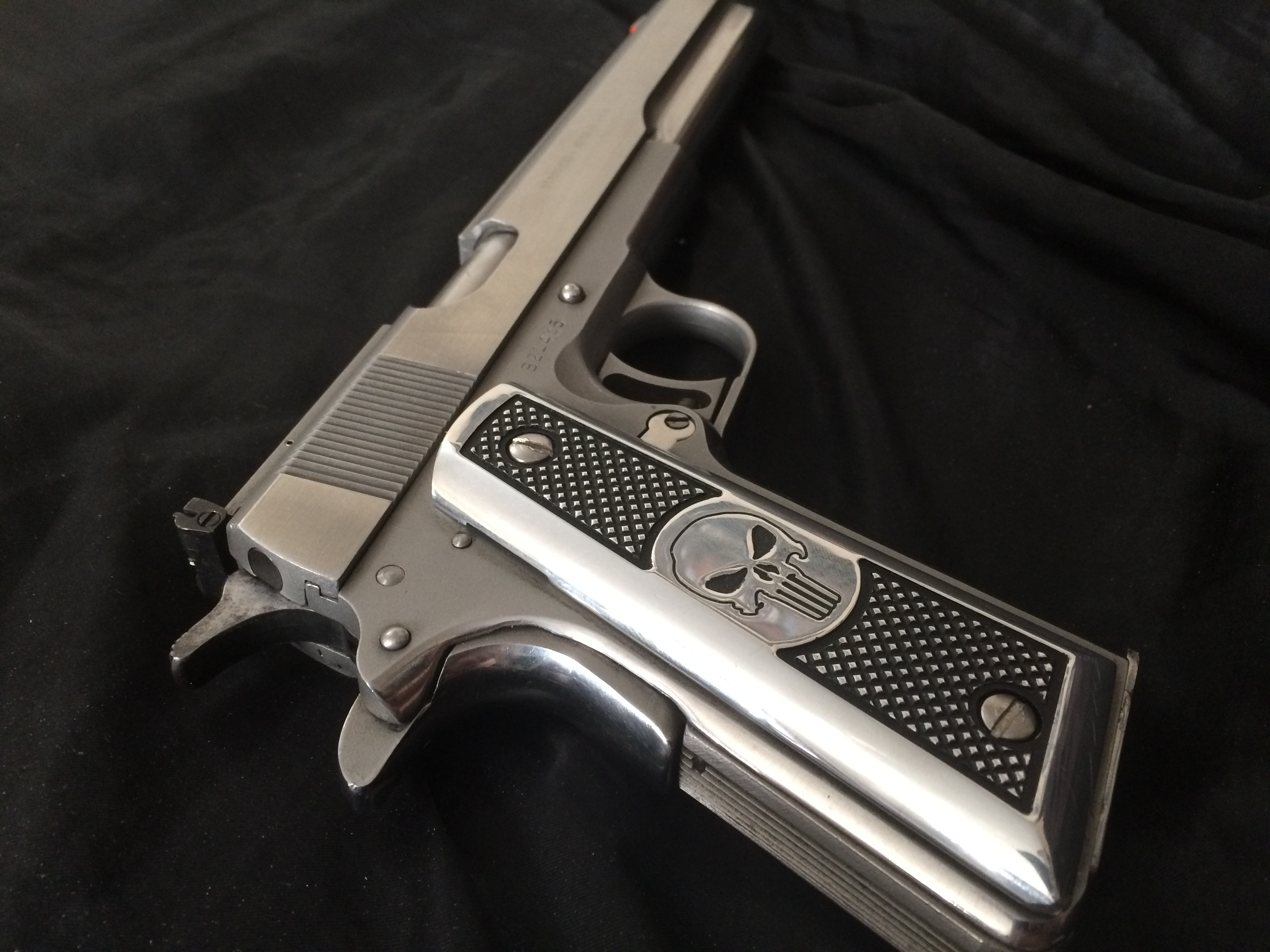 An AMT Hardballer Longslide.  This firearm had issues with its springs.  I also had custom Punisher grips made and polished the entire firearm to a mi