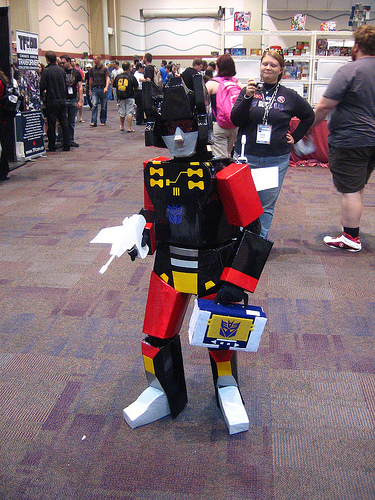 Botcon '10, Frenzy makes his way through the crowd while Mom (me) isn't too far behind her mini-con, camera in hand.