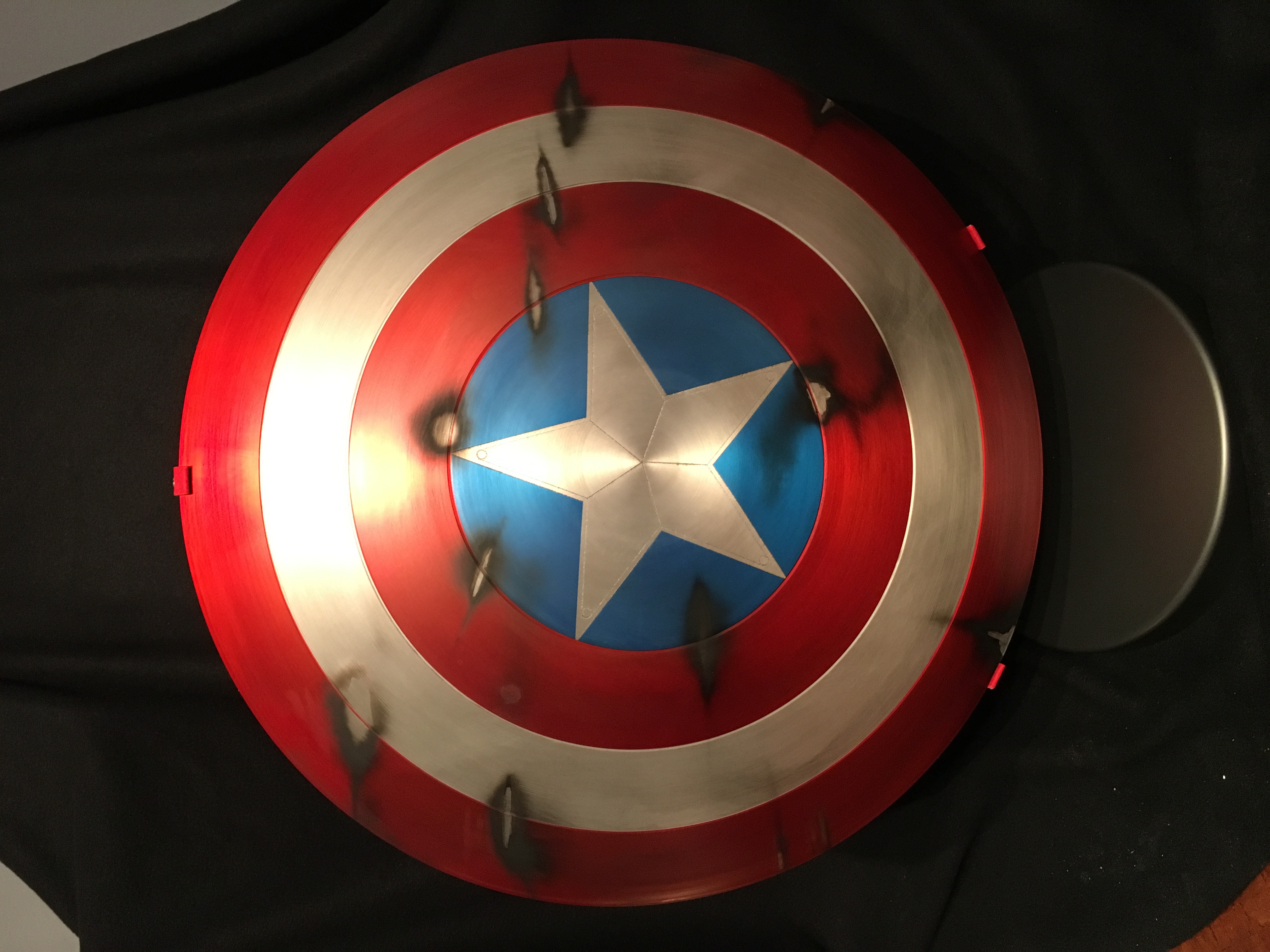 Captain America "The First Avenger" Battle Shield
Shield by phebert
Paint and weathering by Artisan FX displayed in custom Artisan FX shield base