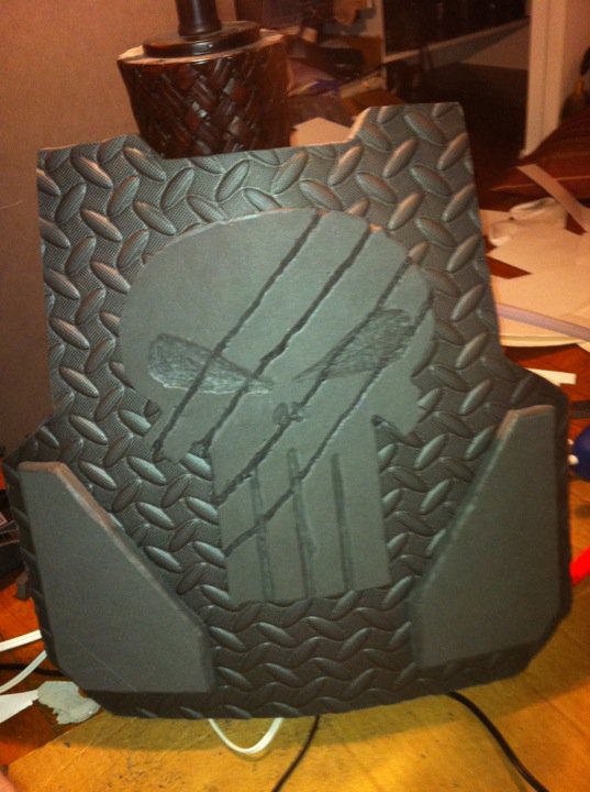 Early photo of the chest piece with the armor plates attached and the skull with Deathclaw marks on it ;)
