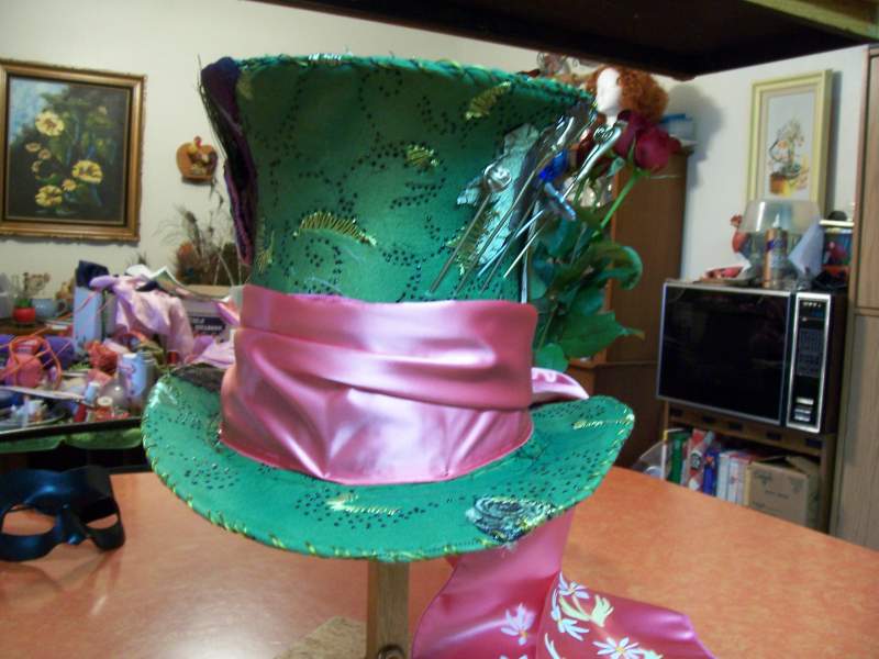 Hat looks real Minty, but its much darker in person. It tends to change color depending on the angle you look at it.