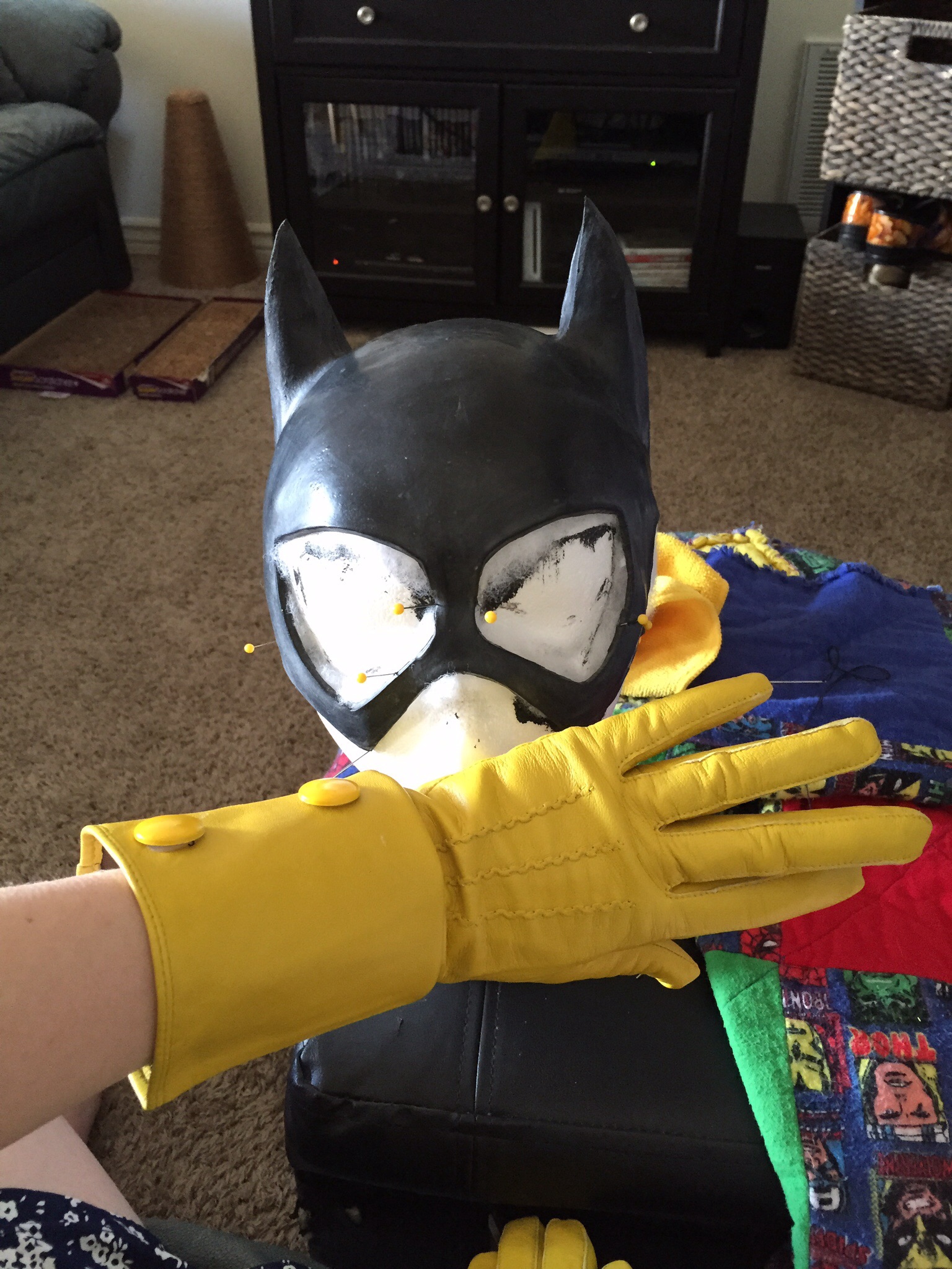 I purchased the gloves off ebay and folded them down, and sewed painted googly eyes onto them for the buttons (they would not stay with hot glue).  On