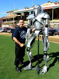 My Cylon Centurion is actually a puppet.  I design him so that he would stand with the aid of a frame which inturn was held up by me.  There are leg e