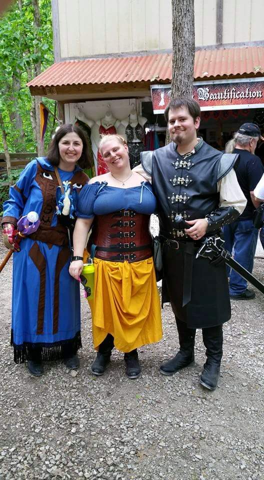 Myself with friends at the St. Louis Renaissance Faire in 2015, holding the Staff of the Four (wizard epic)

...and an Iron Man gauntlet, which is a