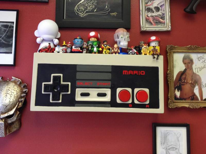 NES shelf i made all out of 1/2 plywood its 10.5' h &24' w ..i made it to have at the shop i work at as a shelf for the figures ppl give me