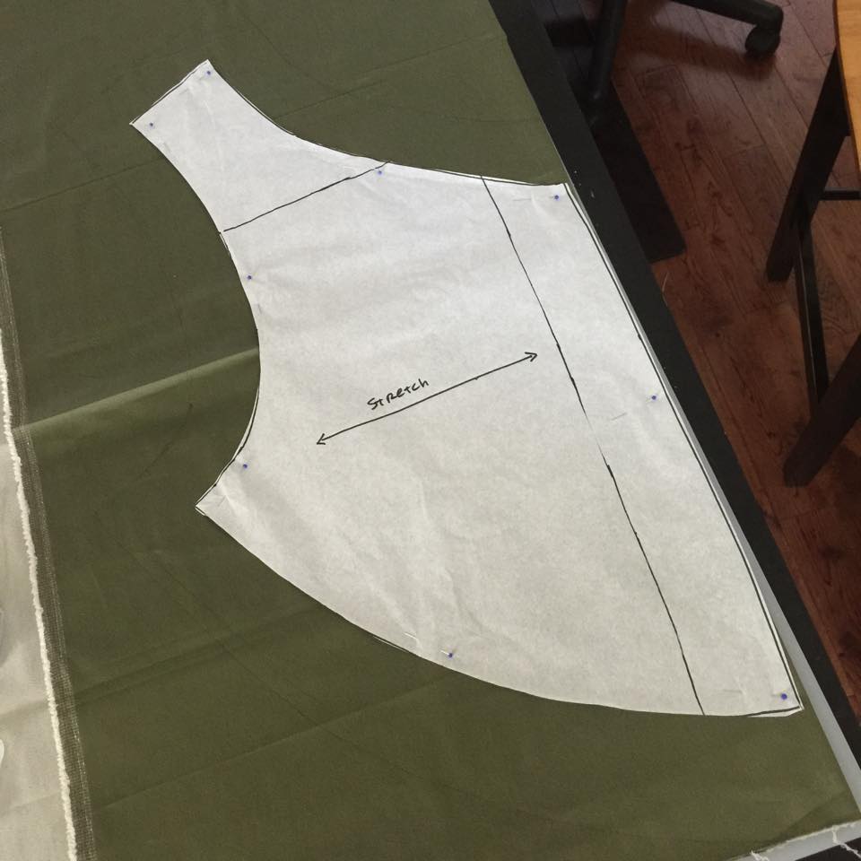 Ok, now onto the fabric! I pulled out my pattern and added two inches to the center seam to account for the additional padding in the abdomen area. I