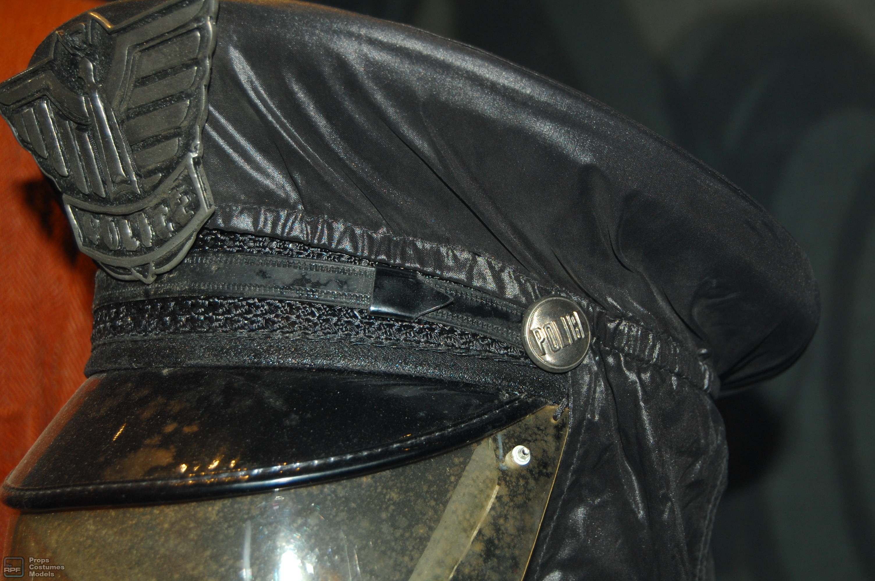 police man cap/helmet and badge