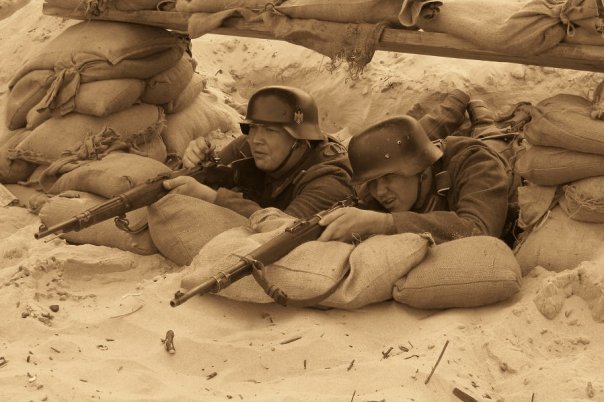 Rifle pit on the beach, D-Day 2008. 
Didn't have as much time to prepare our position on the beach as we did back at camp sadly. Notice our boots up
