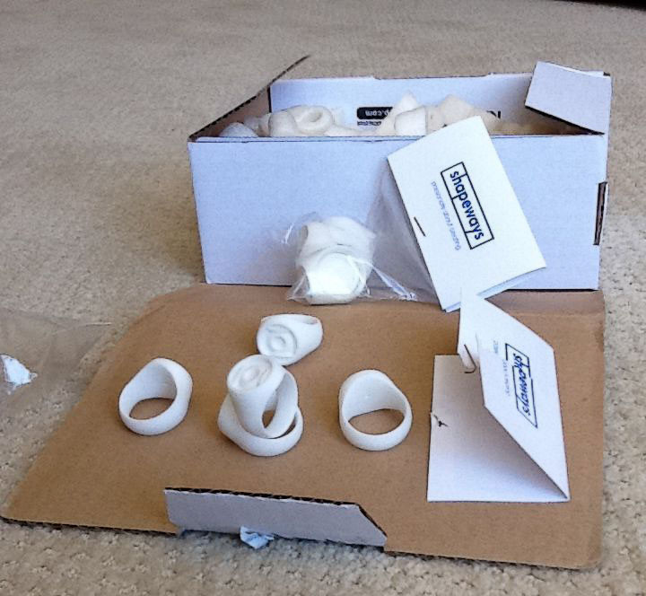 Rings in the raw (3D printed white Polyamide). I used Modo to create the 3D model.