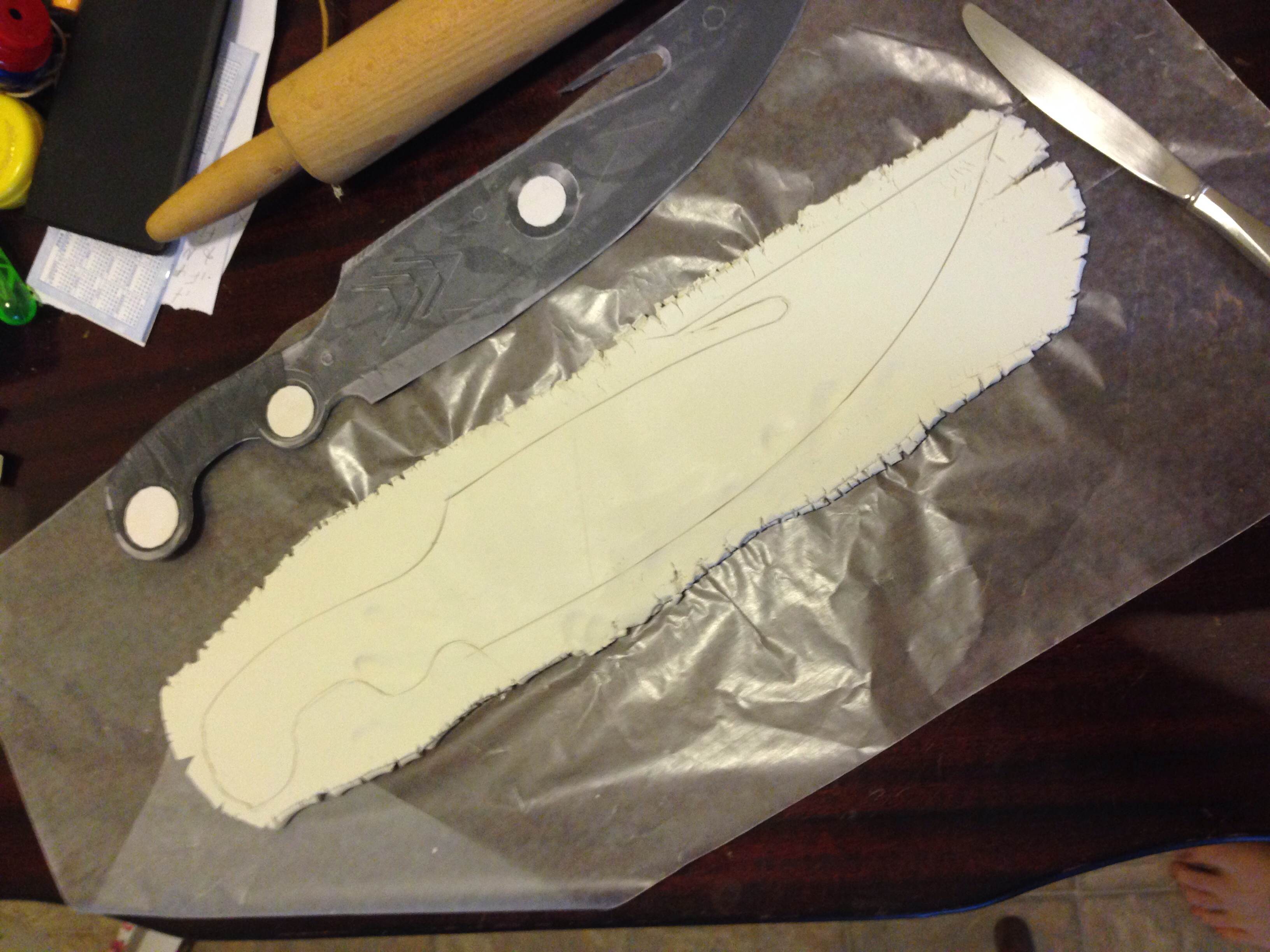 Sculpt start.  Rolled out some Sculpey and traced the knife onto it.