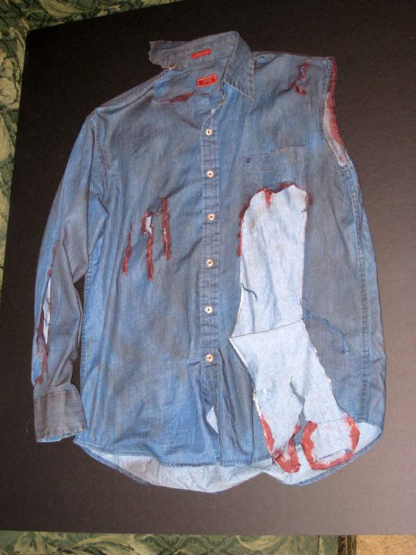 Shirt prop for my Ash costume, bought new and hand torn, dirtied (brown spray paint) and bloodied with fake blood.