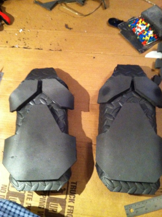 Shoulder armor formed and with plates sitting on top ready to be glued together!