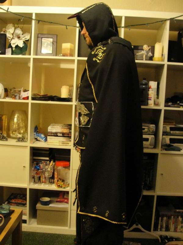 Side view.
Cape, Beaked Hood, all lined in burgandy satin.