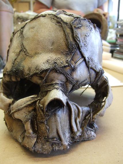 skull mask. Heat formed EVA, formed leather, cast uretane bone-elements, hemp twine, acrylic paints