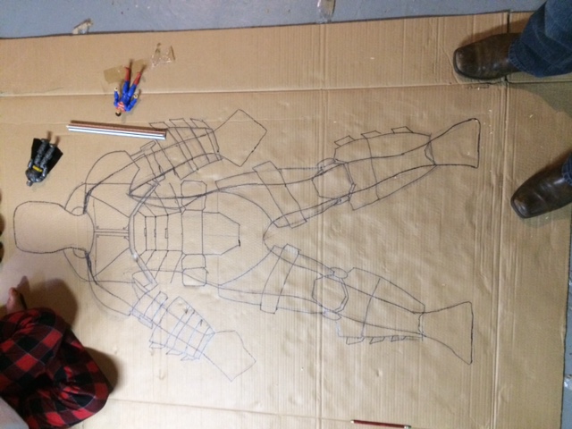 Step 1. Trace his body to get close to accurate scale. Then draw Suit on him. I then will cut out pieces at a time and build. I use rolled foam and tr
