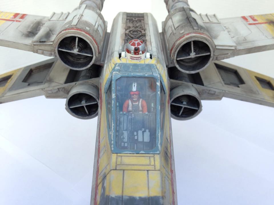 The cockpit with a little Wedge Antilles sitting inside.
