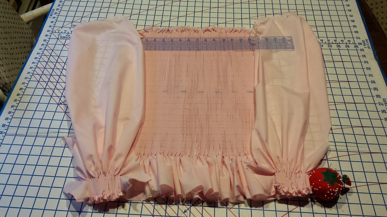 The dress bodice and sleeve wrists ready to be smocked (embroidered).