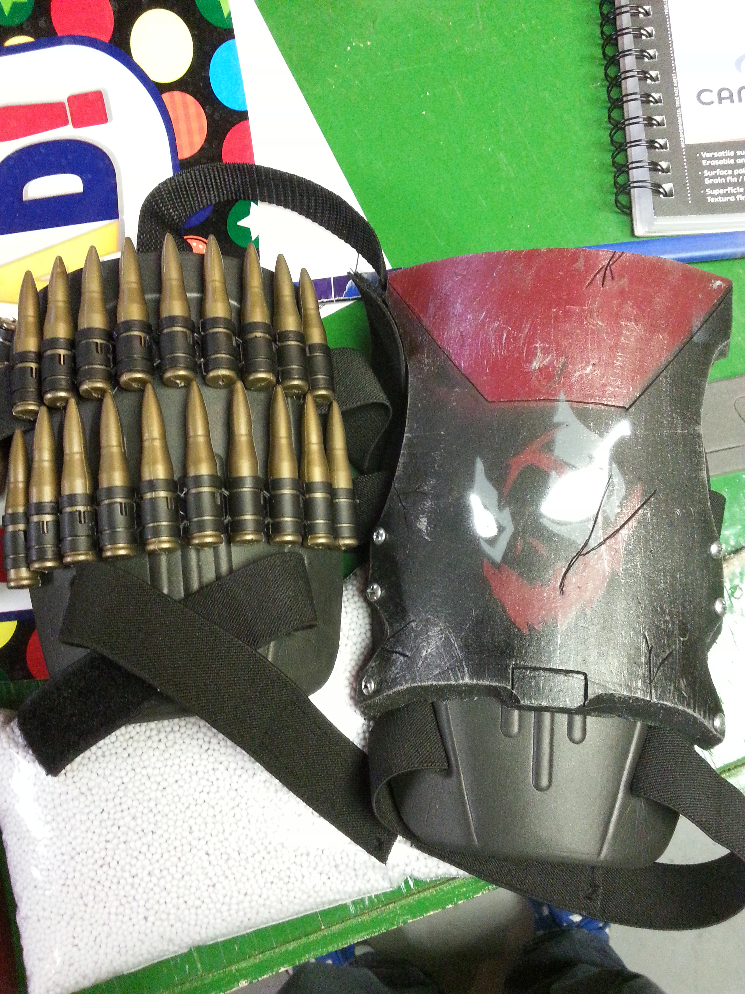 The shoulder pads both left and right with the second Suicide King logo "El Diablo" (It's my rendition of the devil) using stencils and prop bullets.