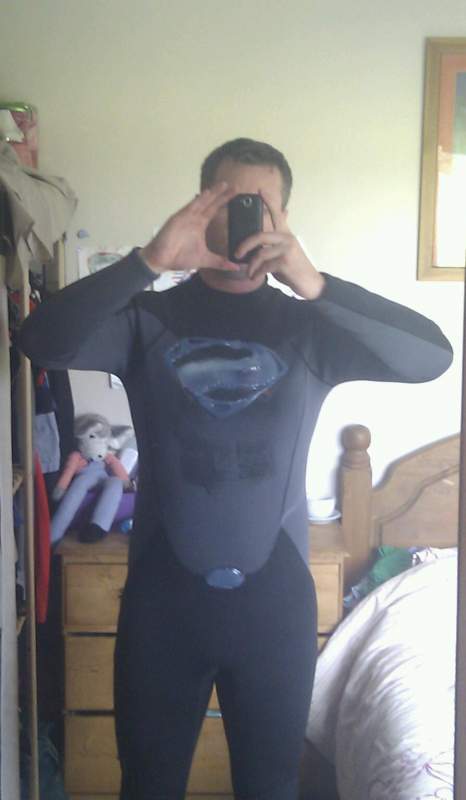 The symbol and belt buckle made from a hot glue gun on a full length wetsuit