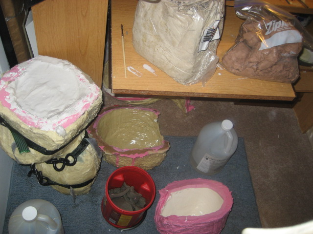 The Zombie in the mold..it is filled with Plaster..will be a week before i pop him out :)

And some of my clays are out Wed on the top left, NSP, Ro
