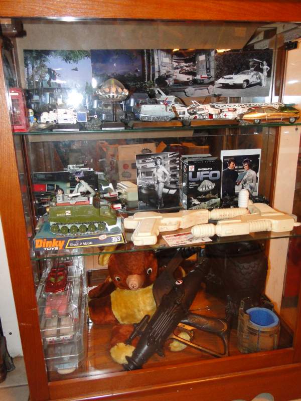 UFO better display. 
Maltese falcon babysitting Radar's teddy.