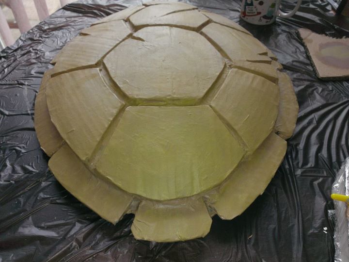 Undercoat the shell with a mixture of whit green and yellow acrylic paint.